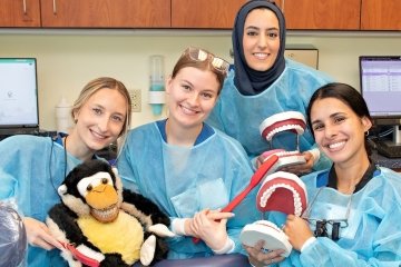 Dental Students pose with animals and props